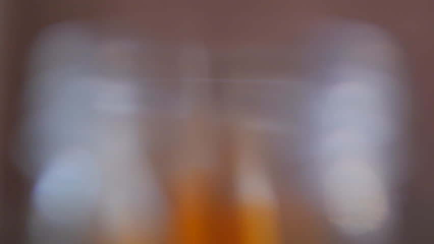 Yellow pencils being picked up out of glass jar in school class studio close up 