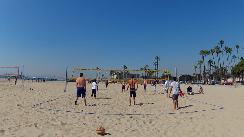 LONG BEACH, CA - February 23, 2013: A wide shot of young men enjoying a game of