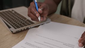 Black Hand Puts Signature on Paper Document. Man signing agreement, close up. - Powered by Shutterstock - Get 15% off with code: PIKWIZARD15