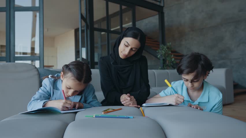 Traditional arabian family from Dubai spending time together at home. Concept about, emirati culture, parenthood, adoption and  family lifestyle