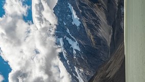 Clouds moving over Mount Cook, Hooker Lake, New Zealand. Vertical close up timelapse.