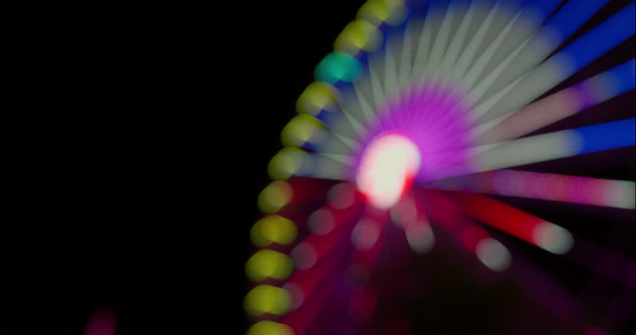 Bokeh Lights Of A Ferris Wheel At An Amusement Park