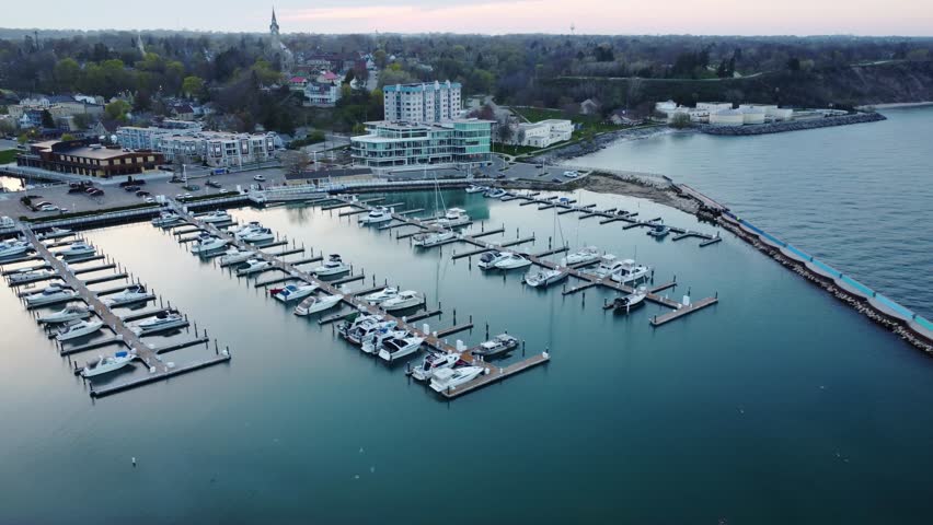Port Washington Harbor And Marina; 4K Aerial Pan Over The Old Historic Downtown City Landscape.