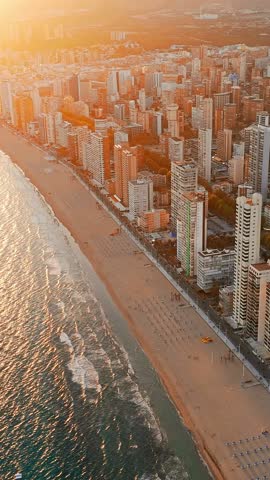Aerial view of the Benidorm cityscape at sunset, Valencian Community, Costa Blanca, Spain. Skyscrapers of Benidorm resort city at the Eastern coast of Spain.