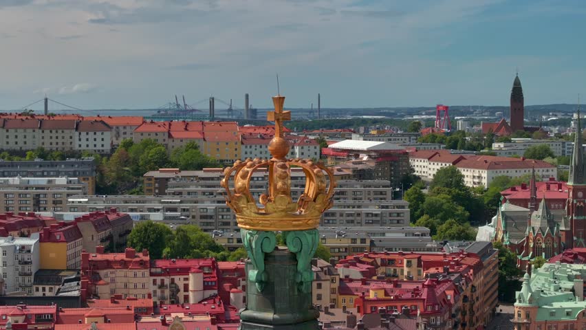 Scenic aerial view of the Old Town with Oscar Fredrik Church in the gorgeous sunset, Gothenburg, Sweden. rooftops panoramic view, Klippan port in Gothenburg harbor in afternoon, Famous bridge 