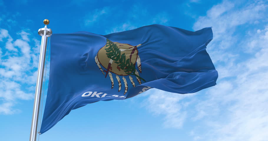 Flag of Oklahoma realistic waving in the wind with sky background (Perfect Loop)