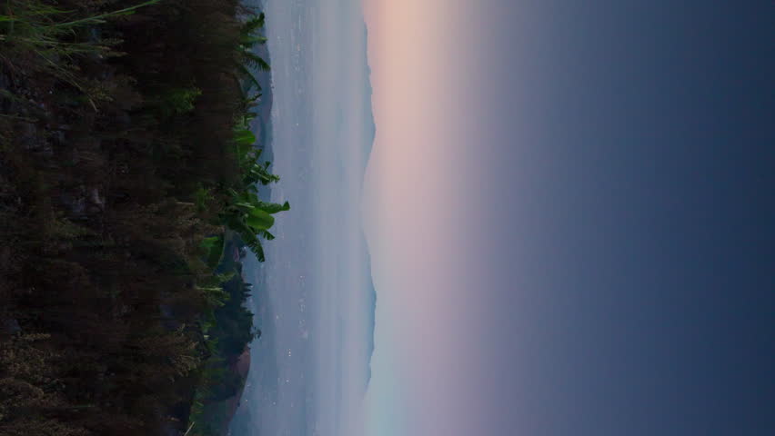 Vertical video - Morning foggy timelapse of Bandung city, taken from Bukit Moko, Indonesia Royalty-Free Stock Footage #3501505887
