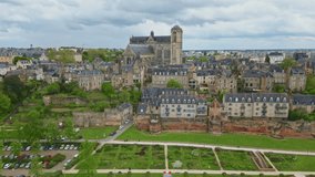 Gourdaine Garden along ancient walls of Le Mans with Saint Julien Cathedral, France. Aerial forward