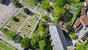 Drone flying over Botanical garden of Bishopric, Limoges in France. Aerial top-down forward