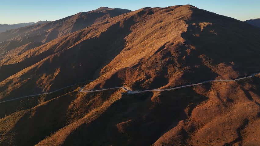 Scenic road over the mountains in New Zealand, Cardrona, Crown Range. Aerial high rise landscape