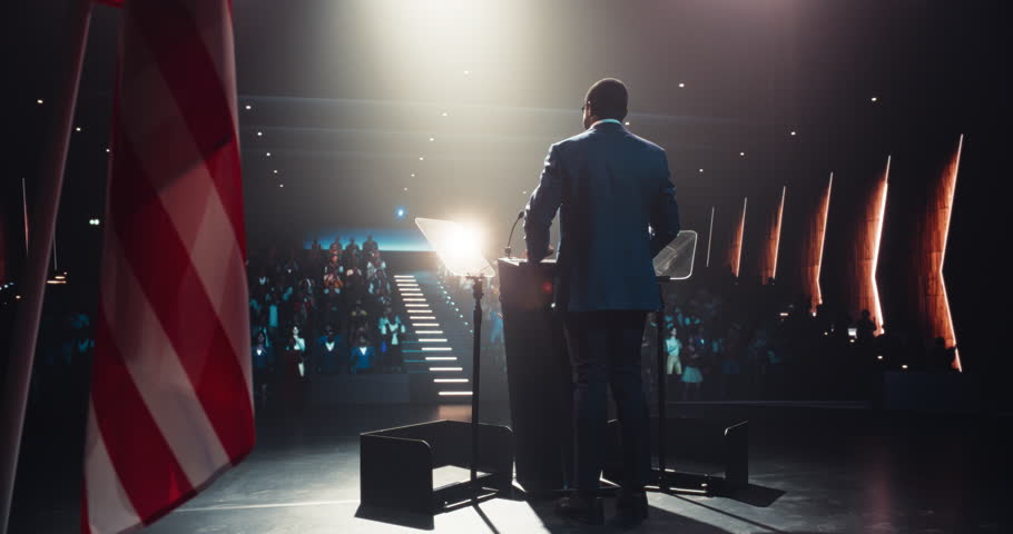 Politician Delivering a Speech at a Campaign Rally. Political Party Member Giving a Passionate Presentation to Excited Voters, Promising Wealth and Prosperity to United States of America