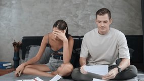 Stressed family couple worried about overwhelming and massive credit card bill invoice or final mortgage loan notification. Marriage problem due to bankruptcy risk from bad financial spending. Adit - Powered by Shutterstock - Get 15% off with code: PIKWIZARD15