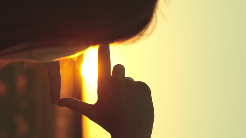 happy woman girl hair traveler shows hands gesture frame sunset dream, sunset motivational scene, dream pursuit concept, personal growth vision, life target handframe, motivational scene snapshot