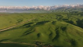 View from a quadcopter of a picturesque mountain plateau on a spring evening
