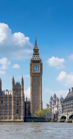 Time lapse view of the Big Ben clocktower in London, England, during a sunny summer day with light clouds