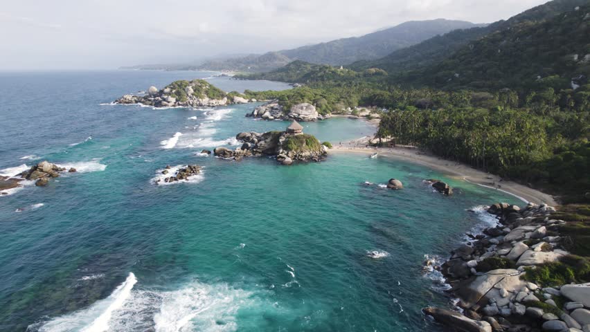 Aerial orbiting view of Famous Cabo San Juan beach bay in Tayrona National Natural Park, Colombia