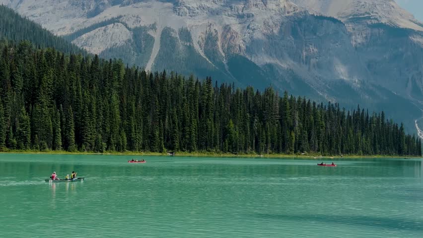 Emerald Lake is located in Yoho National Park in Canada. Famous for its emerald color and the splendid view of the Canadian Rockies that frame it. Canoe excursion with family. Trekking to the lake.

