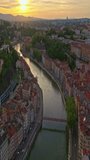 Lyon historical city center with streets aerial drone vertical video footage. Warm summer evening. Sunlight Lyon aerial Lyon France. Famous tourist holiday vacation destination in France, Europe