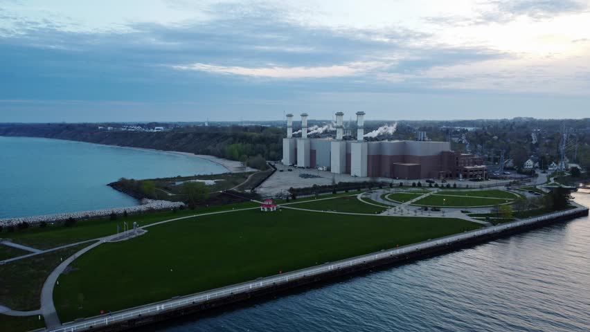 Port Washington (WE Energies) Generating System; Aerial Reverse Shot Revealing The Power Plant, Avian Sanctuary, And Green Open Recreational Space.