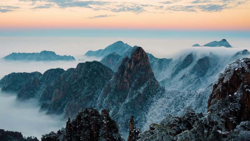 Time lapse looking out over a sea of fog at the Yellow Mountains (Huangshan) in China at sunset