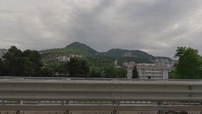 view of the roadside and landscape on a summer day, beautiful views, highway, mountains and sky