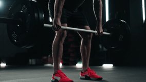 Unrecognisable man doing a deadlift, weight training in the dark gym - Powered by Shutterstock - Get 15% off with code: PIKWIZARD15