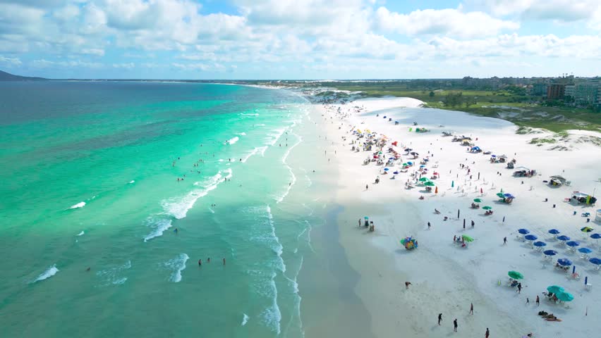 Aerial view of crowded Varadero Beach with a white sand dunes on the Emerald Coast. Royalty-Free Stock Footage #3502263535