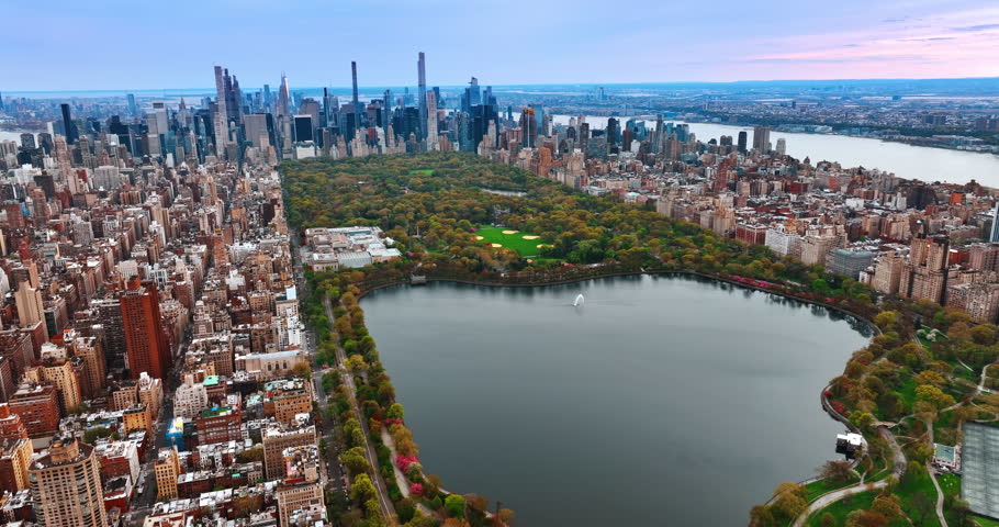 Cityscape of New York with the view on Central Park and splendid architecture. Aerial perspective on the vast metropolis in the evening.