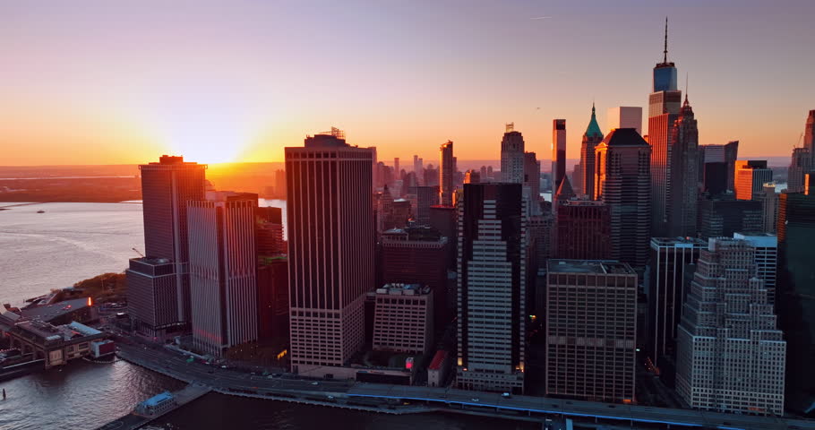 Sunset in luxurious New York. Last rays of setting sun illuminate the facades of skyscrapers in Manhattan.