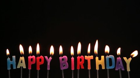 colourful happy birthday candles being extinguished Stock Footage Video ...