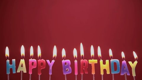 Happy birthday candles on red background