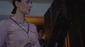 Animation of shapes moving over diverse workers using tablet in server room. Global technology and digital interface concept digitally generated video. - Powered by Shutterstock - Get 15% off with code: PIKWIZARD15