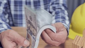 Engineer counting dollars concept of income from work - Powered by Shutterstock - Get 15% off with code: PIKWIZARD15