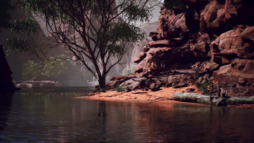 Reflection in Colorado River of Butte catching days last rays, in Grand Canyon.