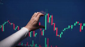 Successful female trader showing with hand heart gesture on computer screen with graphs and charts stock market. Concept of investing money on shares, analyzing stock market and financial, slow motion - Powered by Shutterstock - Get 15% off with code: PIKWIZARD15