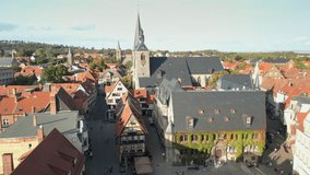 Aerial view of Quedlinburg, town hall in the foreground in beautiful golden evening light, Saxony-Anhalt, Germany. High quality footage in 4k format