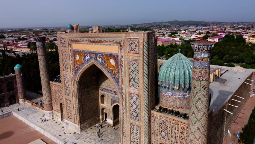 Aerial view of The Registan Square. Ulugh Beg Madrasah,  Tilya-Kori Madrasah. A popular tourist destination of Central Asia. Samarkand, Uzbekistan Drone