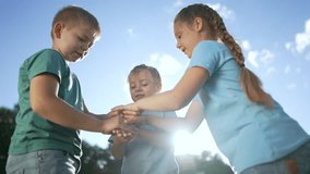 Children together in forest park outdoors. joint goals.team of children walk together in forest park on green grass.path to success in team. team creation. team games in a forest park. way to success - Powered by Shutterstock - Get 15% off with code: PIKWIZARD15