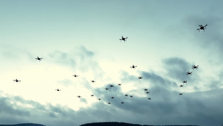 Swarm of Drones Flying in Overcast Sky - Powered by Shutterstock - Get 15% off with code: PIKWIZARD15