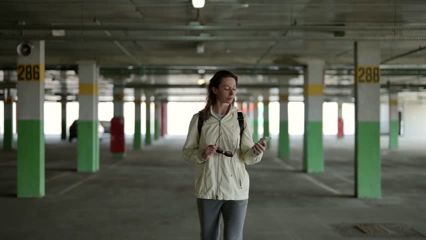 A middle-aged woman portrait. The mobile phone becomes an integral part of her style and image, emphasizing her active lifestyle and willingness to communicate.