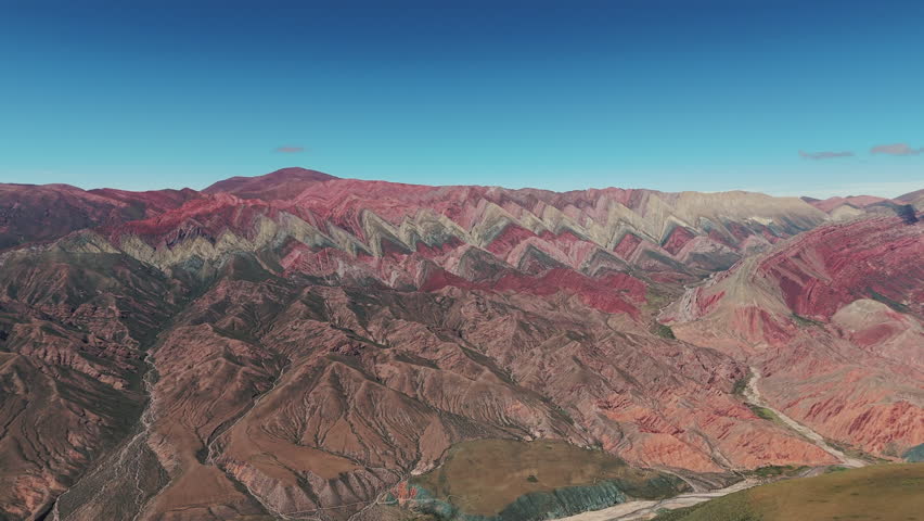 An open-air canvas known as El Hornocal, or Cerro de los 14 Colores, showcasing vibrant colors and stunning geological formations in the Quebrada de Humahuaca, Jujuy, Argentina.