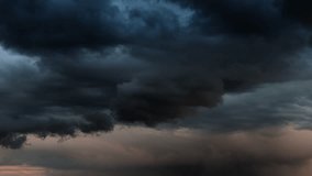 CLOUD SERIES 12: Dark huge cloud sky black stormy cloud motion big stormy rain day thunderstorm clouds dancing panorama horizon Time lapse blue cloud moving oxygen Storm giant moving fast movie time - Powered by Shutterstock - Get 15% off with code: PIKWIZARD15