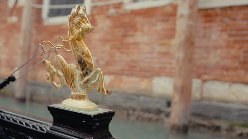 A close-up view of gold seahorse embellishment adorning a traditional gondola Royalty-Free Stock Footage #3503111337