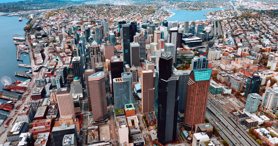 Huge dense cityscape of Seattle, Washington State, the USA at daytime. Skyscrapers stand out in the landscape of metropolis. Top view.
