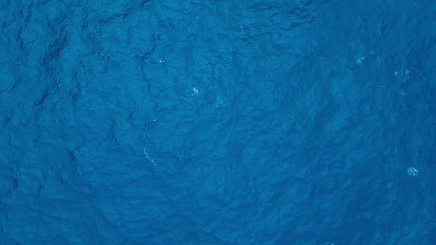 Ocean surface with waves and ripples. Aerial top to down view, static shot