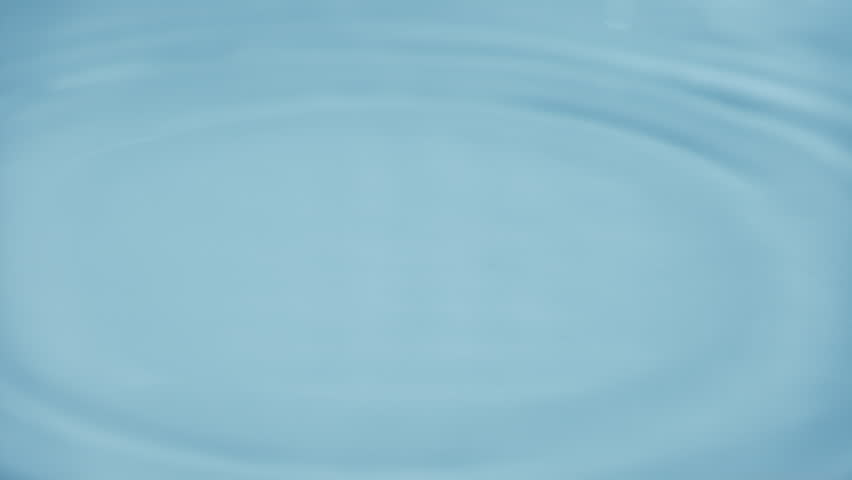 Natural mineral water splashing. Crystal clear drop of cosmetic essence serum falling in slow motion. Body moisturizing cosmetics formulating. Commercial beauty product blue liquid abstract background