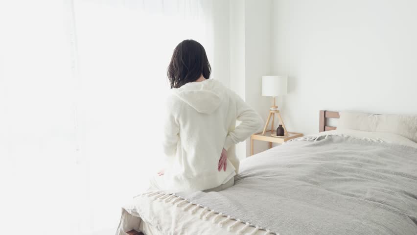 A woman caring about her painful lower back