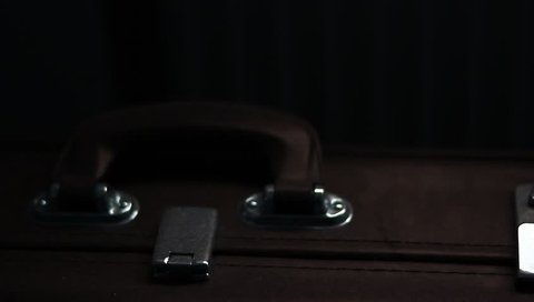 Dark, old, dusty suitcase