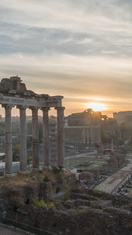 Morning time-lapse of historic Roman Forum ruins. Sunrise over Forum Romanum famous ancient travel landmark of Rome, Italy. Archaeological site and popular tourist attraction in center of the city.