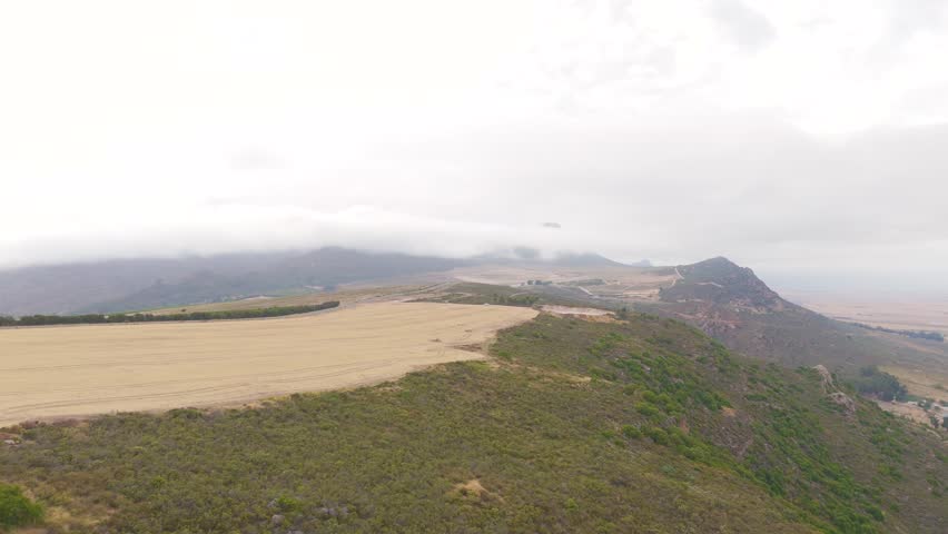 A drone shot of Cederberg, an area in Cape Town. It focuses more on the greenery and we see that the weather is cloudy.